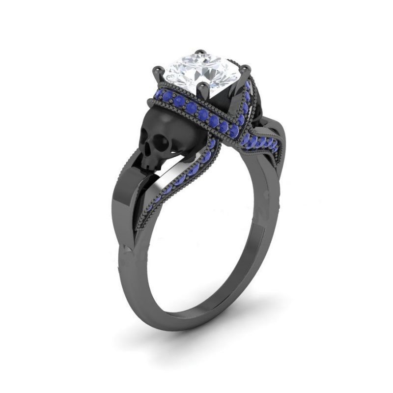 White & blue diamond black skull ring